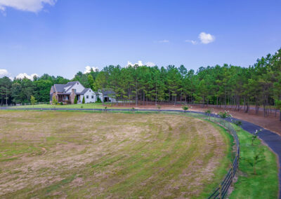 A scenic wide-angle view of a 4-bedroom home from Walker Auctions
