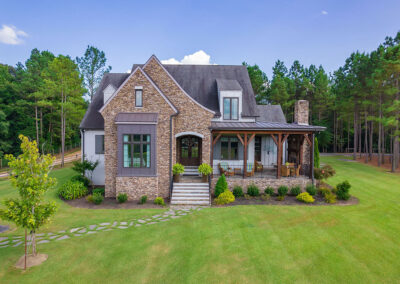 Front exterior of a custom-built luxury home for sale