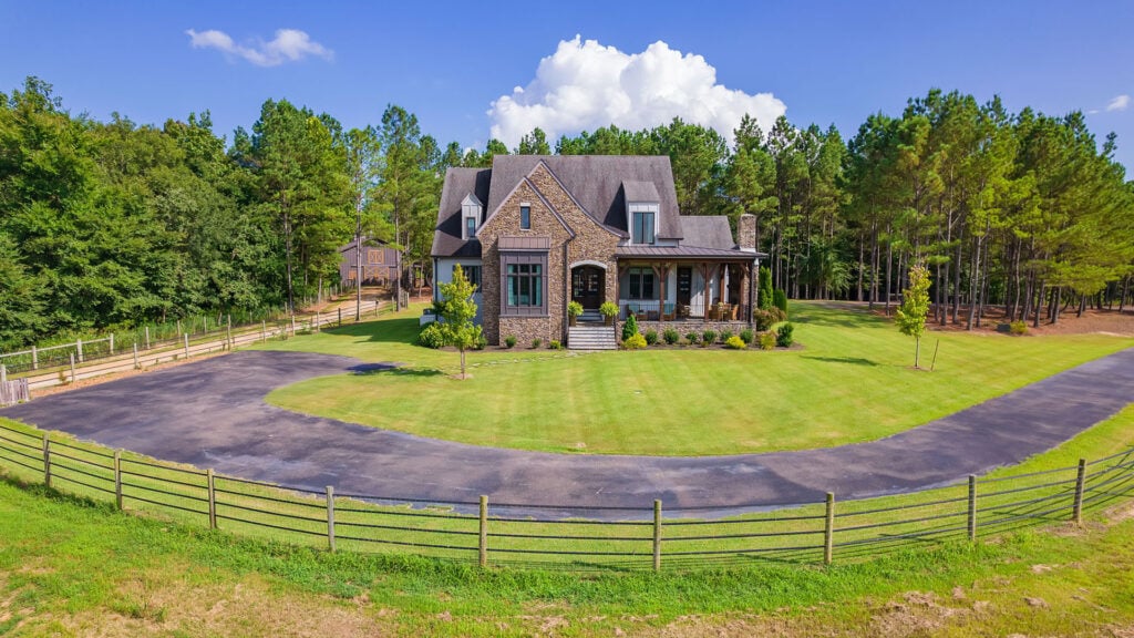 Wide-angle exterior shot of a custom 4-bedroom home at at 348 Countryside Dr in Lexington, TN